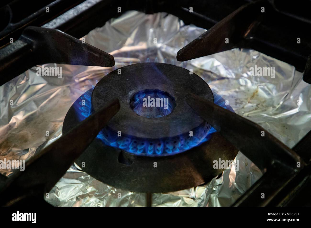 Stoves. Kitchen room. Gas stove with burning propane gas flames