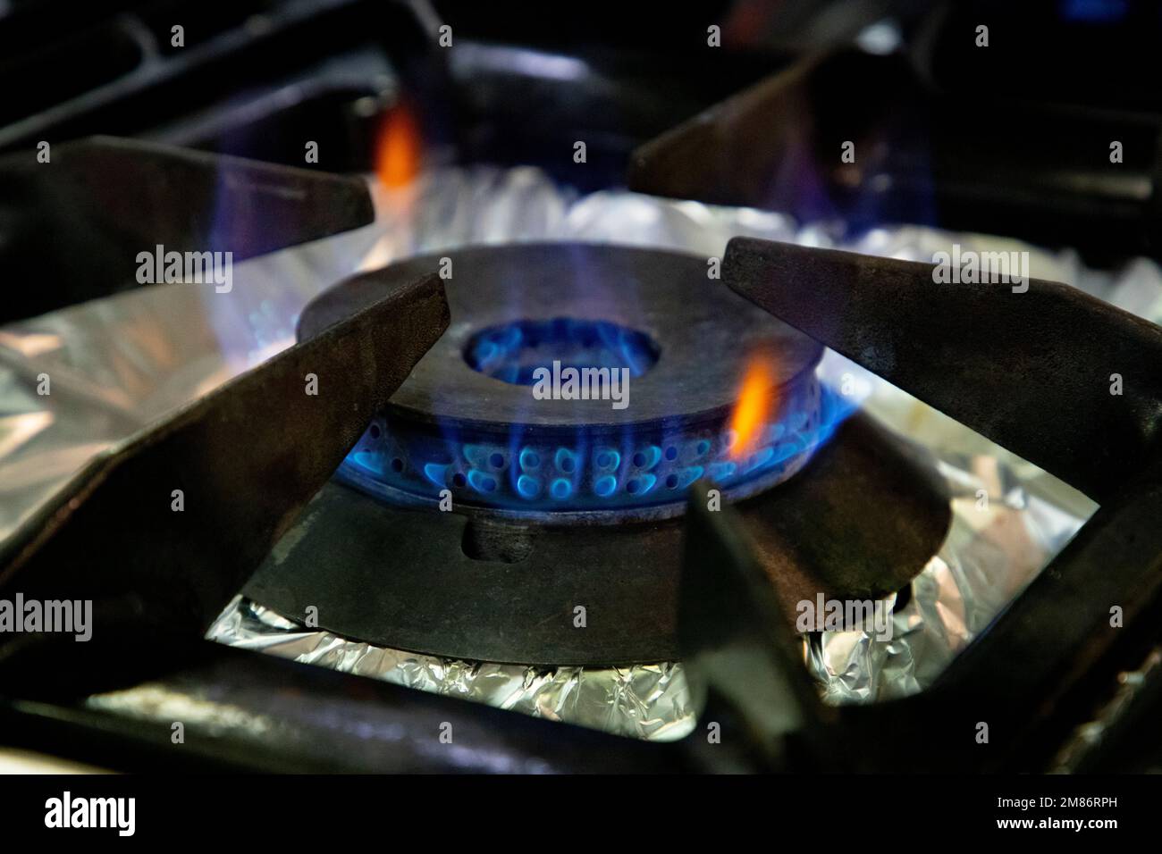 Stoves. Kitchen room. Gas stove with burning propane gas flames