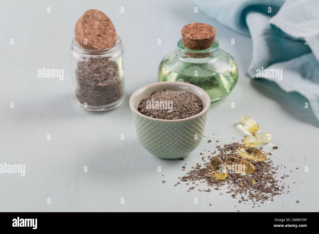 Gelatin capsules with algae omega oil and seaweed on a light blue background Stock Photo Alamy