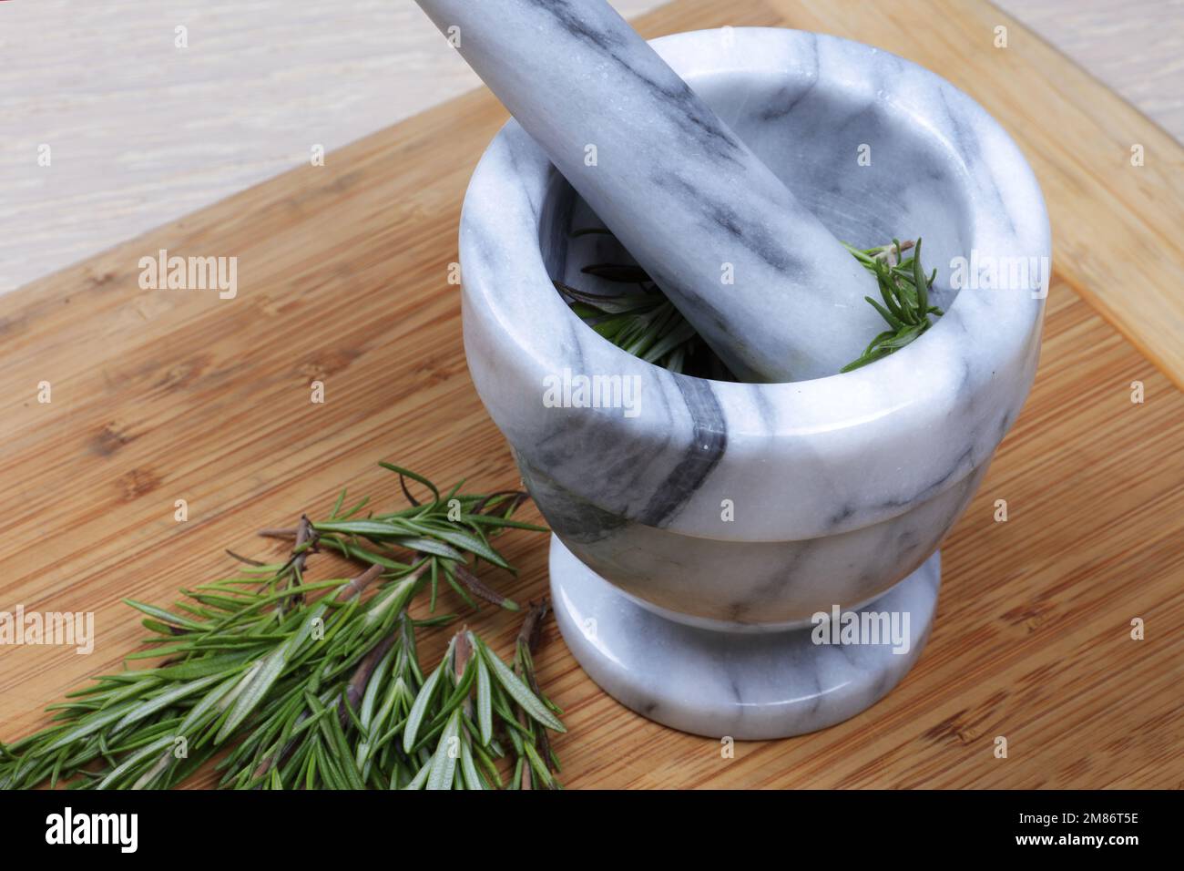 Rosemary herb in a mortar and pestle from above Stock Photo Alamy