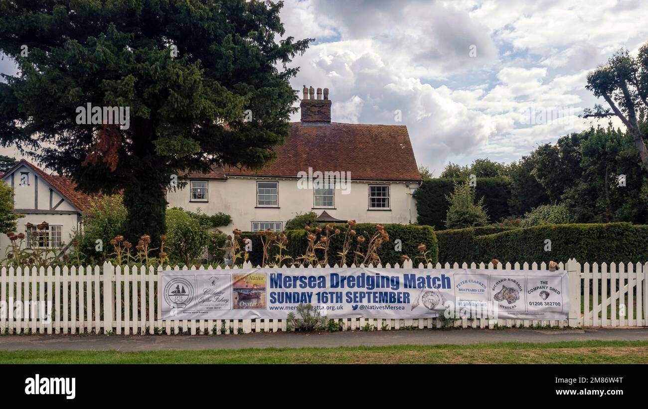 WEST MERSEA, ESSEX, UK - AUGUST 31, 2018:  House along the Coast Road with sign for 2018 Dredging Match Stock Photo