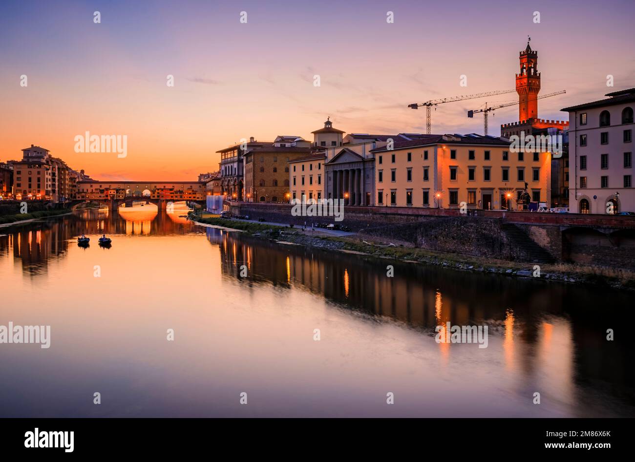 Sunset cityscape with the famous bridge of Ponte Vecchio on the river Arno River and Palazzo Vecchio in Centro Storico, Florence, Italy Stock Photo