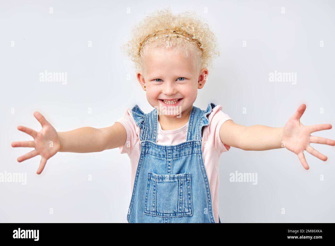 Expressive Hug young expressive emotional blonde girl stretching arms for hug, looking ...