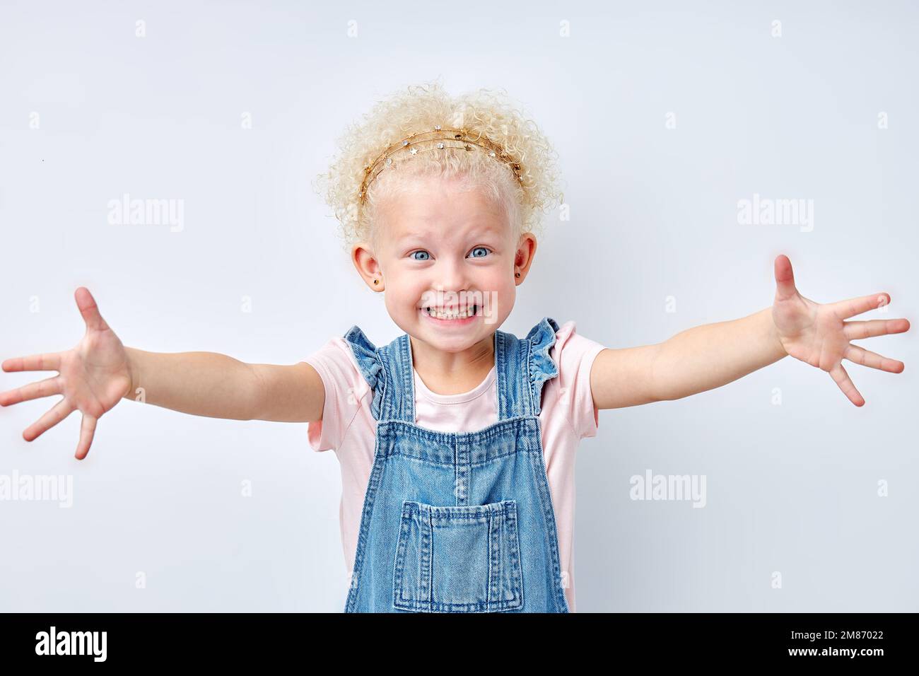 Expressive Hug excited expressive emotional blonde girl stretching arms for hug ...