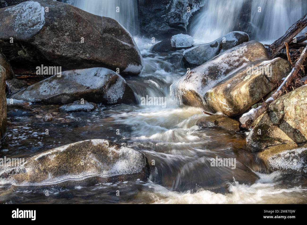 the icy waters of trap falls flowing into trap falls brook in willard