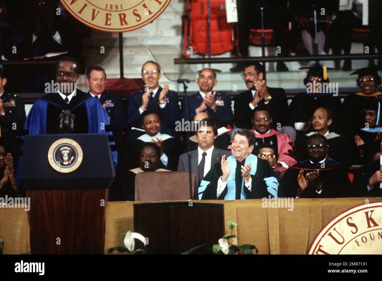 President Ronald Reagan applauds remarks of Dr. Benjamin Payton