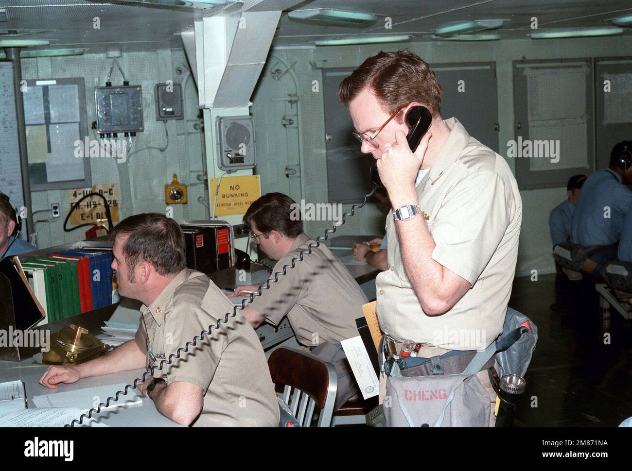 Members of a damage control training team coordinate an exercise from ...