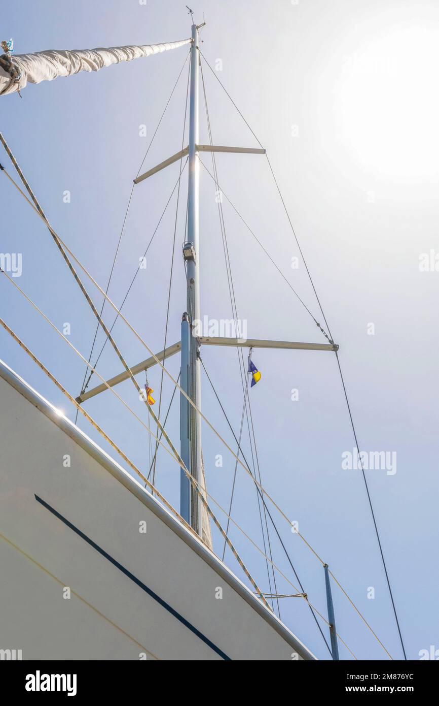 Profile view of a sailboat with reefed sails Stock Photo
