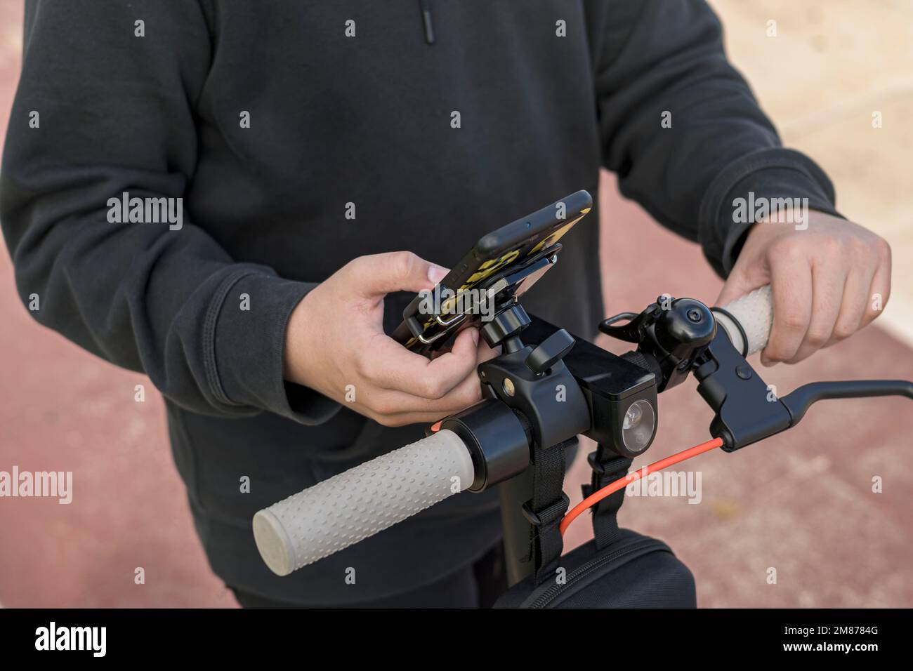 hand touching smart phone screen, using music and navigation app