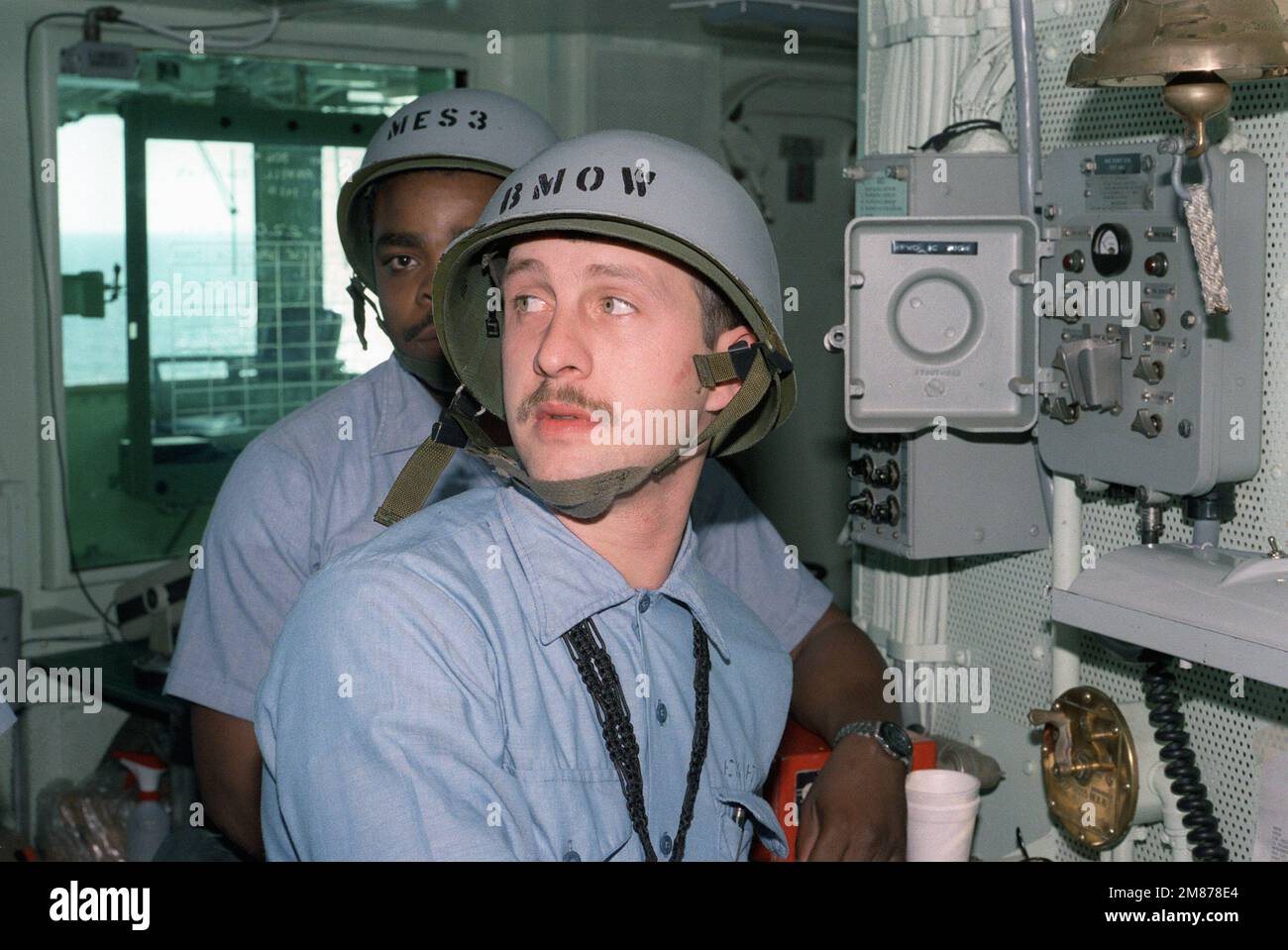 The boatswain's mate of the watch mans his station during a general