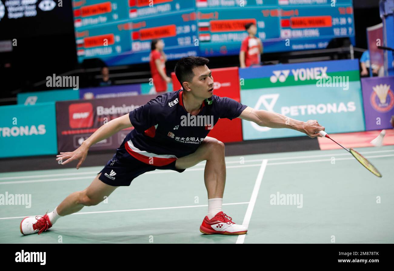 Zhao Jun Peng of China plays against Loh Kean Yew of Singapore during the Mens Single second round match of the Petronas Malaysia Open 2023 at Axiata Arena