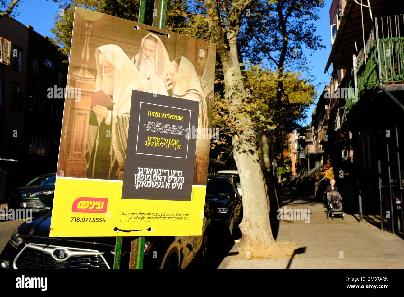 Religious poster in Yiddish posted on a cross street of Lee Avenue.Williamsburg.Brooklyn.New York City.USA Stock Photo
