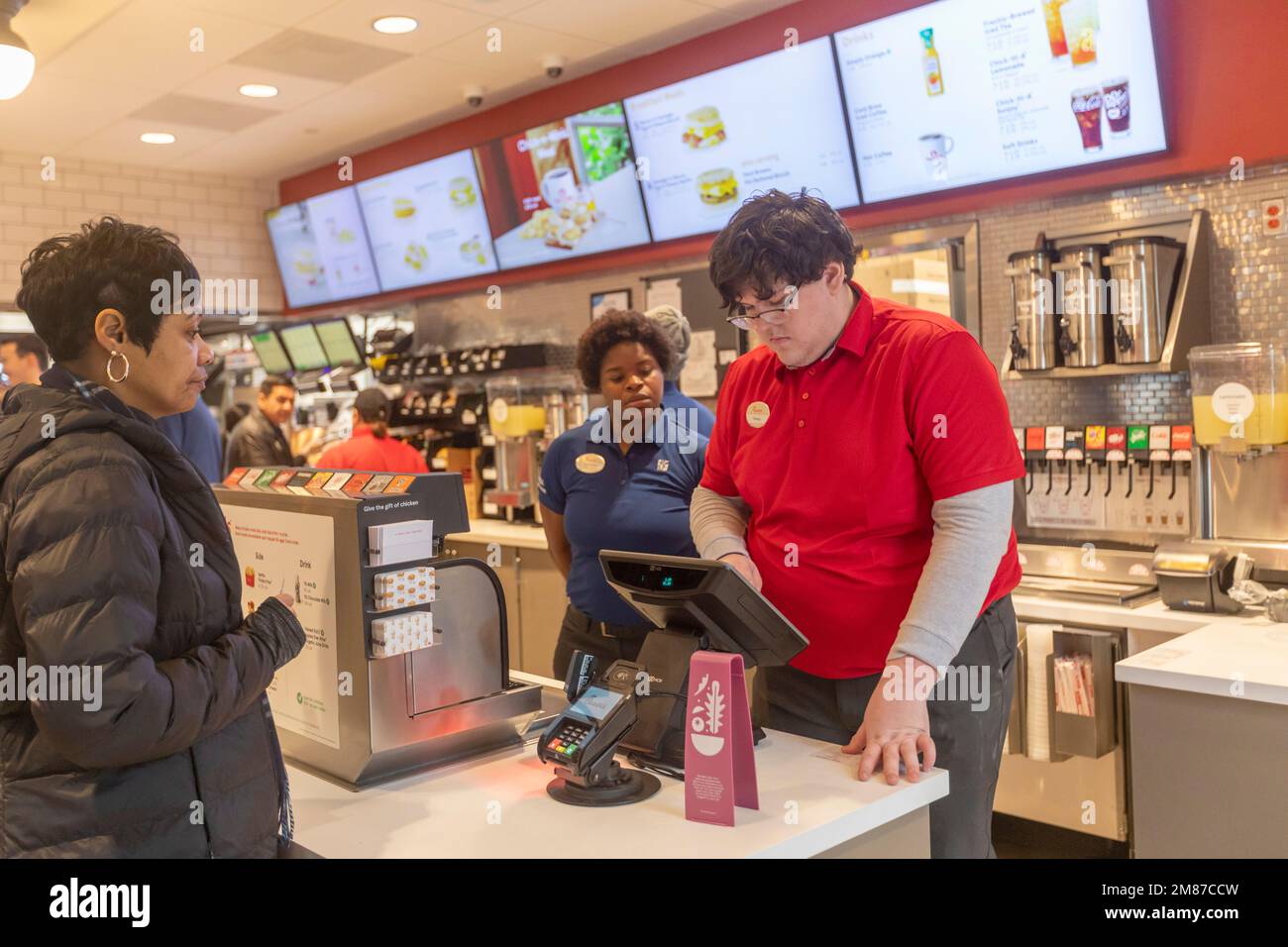 Livonia, Michigan - Workers at Chick-fil-A, on the day of the restaurant's grand opening. Workers in red shirts are the store's new staff, while those Stock Photo
