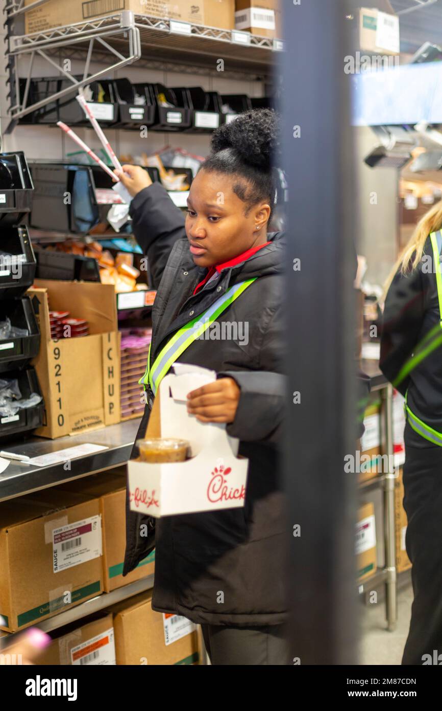 Livonia, Michigan - A worker at Chick-fil-A prepares a drive-through order on the day of the restaurant's grand opening. Stock Photo