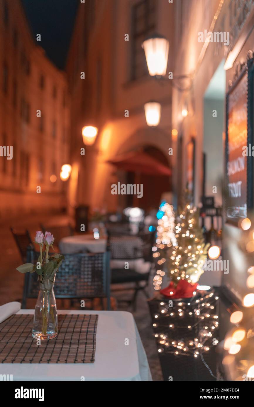 Table View Night A beautiful view of a decorated table in a cozy restaurant at night ...