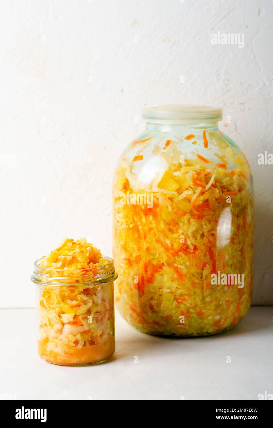 Sauerkraut, Shredded cabbage, apples, and carrots on bright rustic