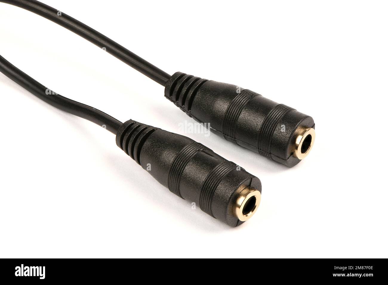 Audio cable splitter, stereo male to two female stereo audio jack 3,5 mm, isolated on a white background. Extreme closeup. High resolution photo. Full Stock Photo