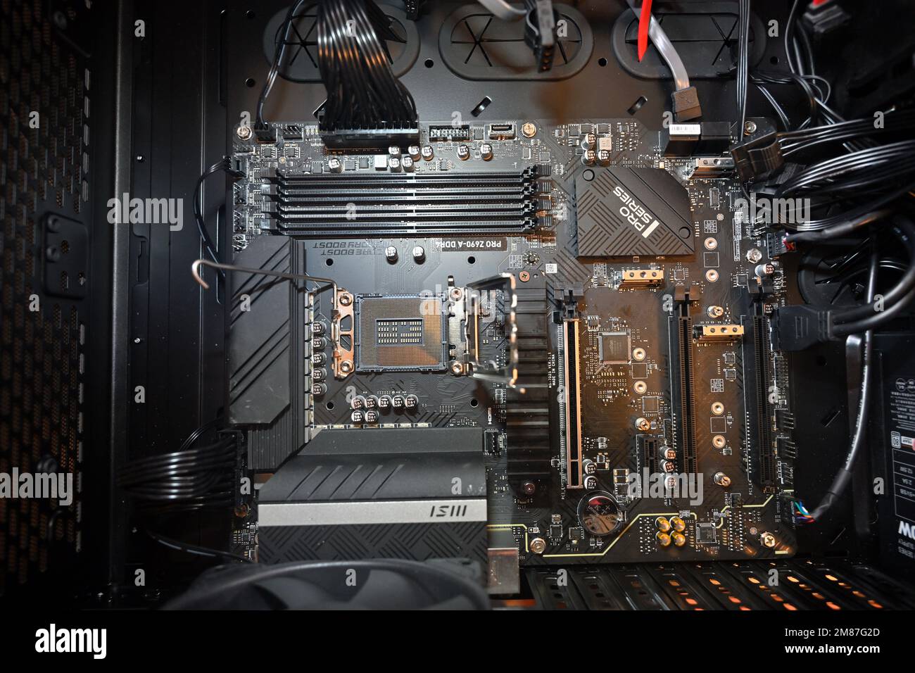 Intel computer motherboard in case without components added, CPU socket on visible, MSI PRO Z690-A DDR4 Stock Photo