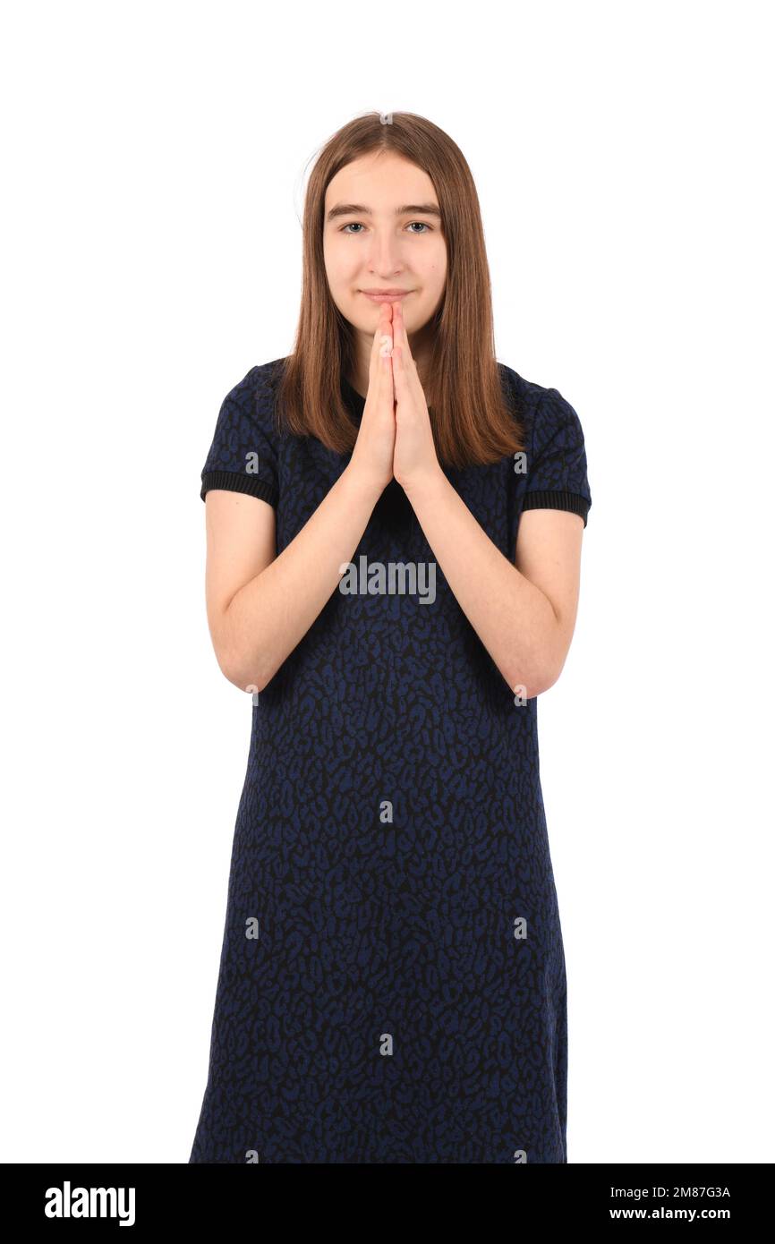 Young beautiful girl in a dark blue dress on a white background ...