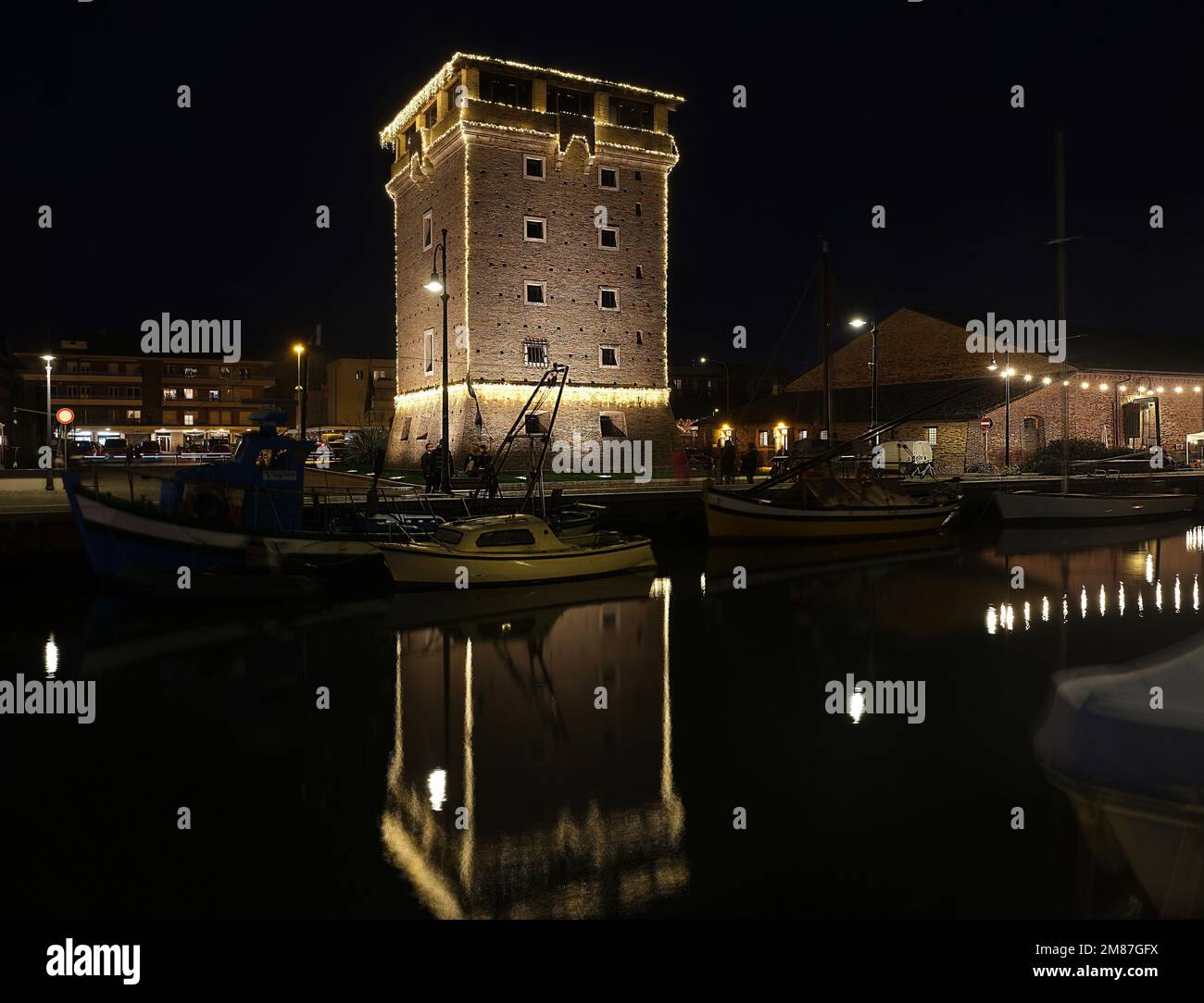 The S Michele Tower With Its Christmas Lights Is Reflected In The The S Michele Tower With Its Christmas Lights Is Reflected In The