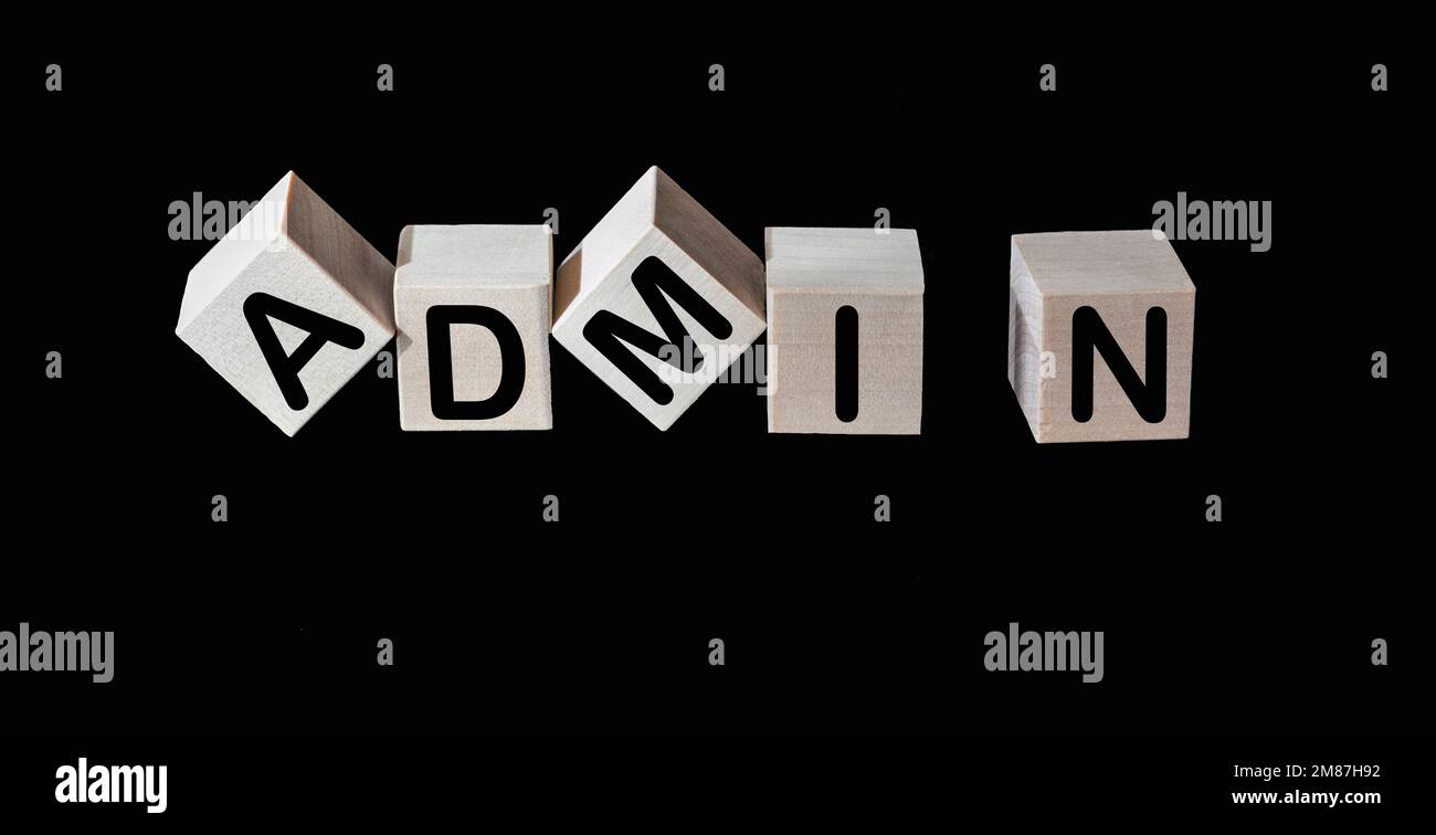 ADMIN word concept written on wooden cubes on black background Stock Photo