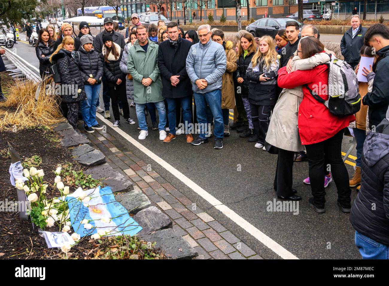 New York, USA. 12th Jan, 2023. Relatives of victims and survivors of the October 31, 2017 attack in New York where 8 people were killed, including 5 from Argentina, deposit flowers at the site of the attack in a bike path in lower Manhattan. Sayfullo Saipov may face the death penalty for the fatal truck rampage in a trial that started this week in a Federal Court. Credit: Enrique Shore/Alamy Live News Stock Photo