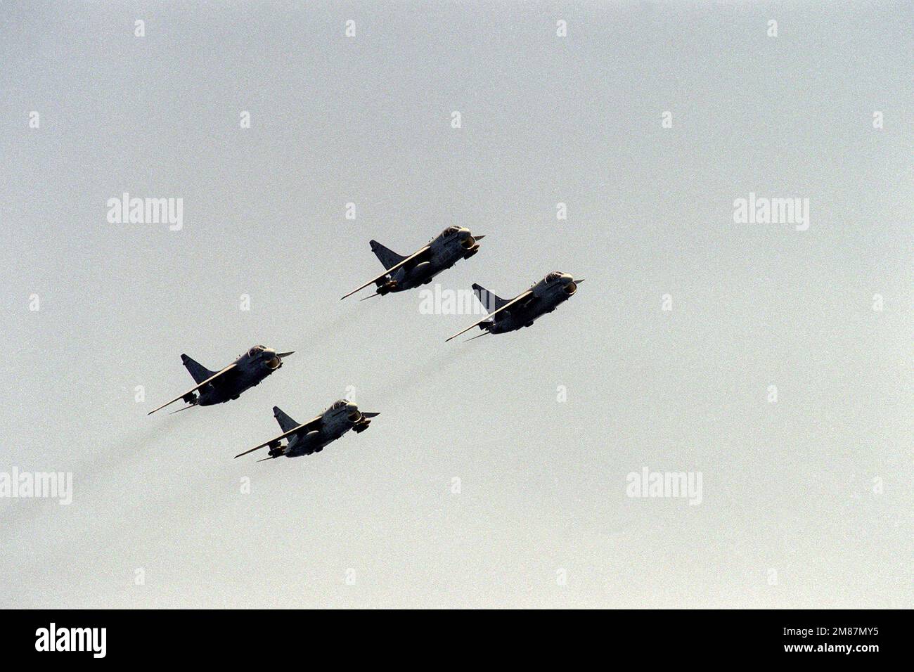 A right side view of four A-7E Corsair II aircraft in formation. Country: Indian Ocean (IOC) Stock Photo