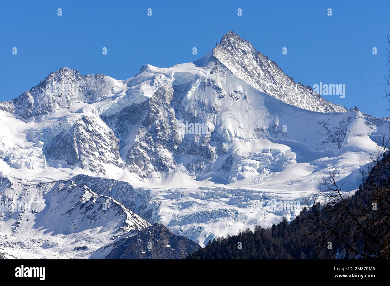 Snowy Zinalrothorn and Moming glacier seen from Grimentz in spring. Grimentz, Val d'Anniviers, Valais, Pennine Alps, Switzerland Stock Photo