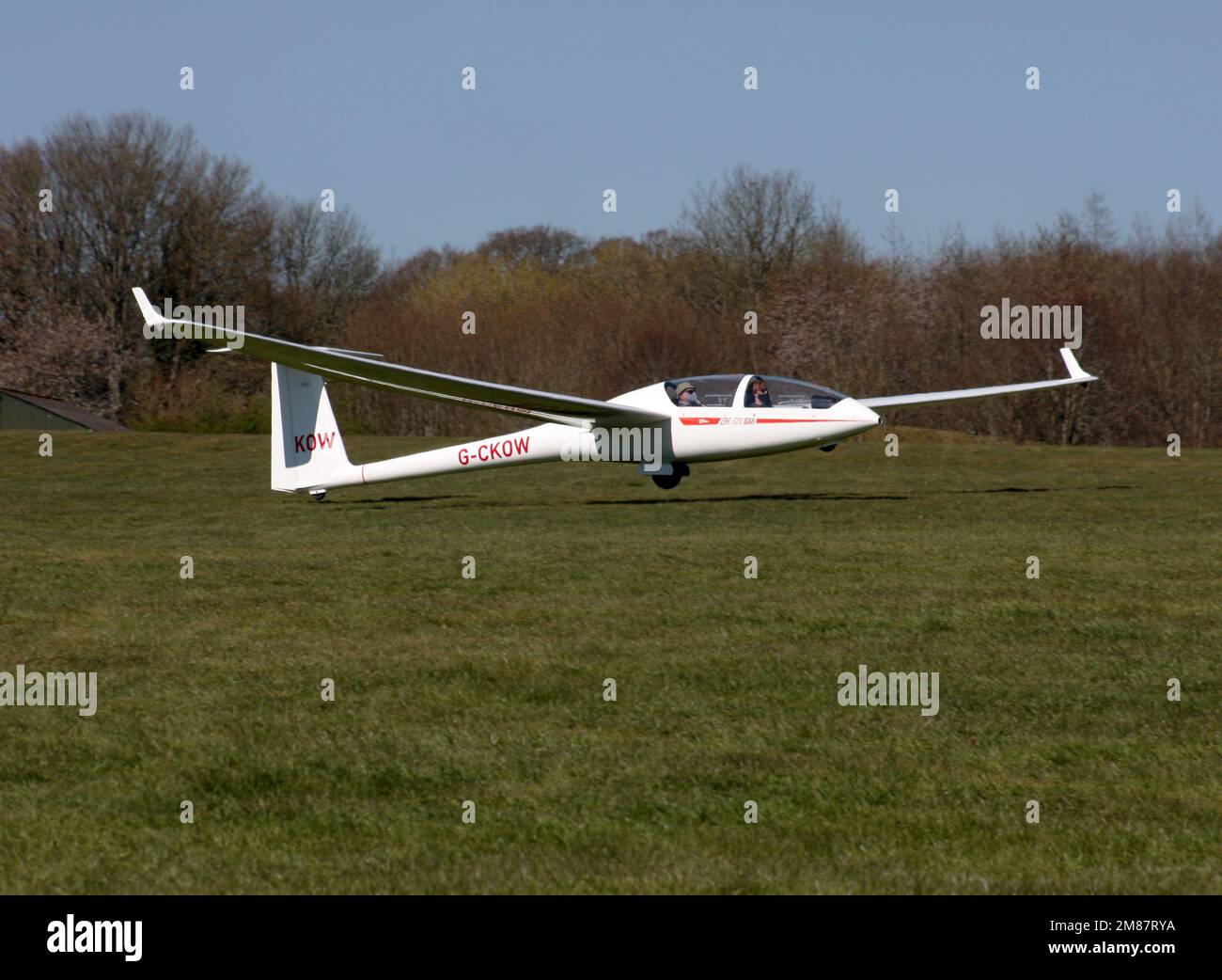 A Glaser-Dirks DG-505 Elan Orion glider touching down at a private airfield in West Sussex UK Stock Photo