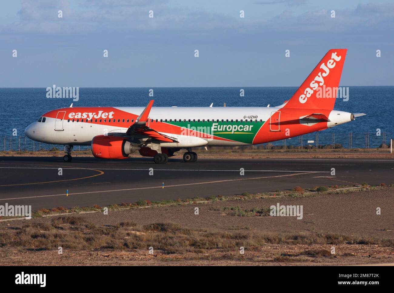 An easyjet a320neo advertising Europcar departs Lanzarote Arrecife