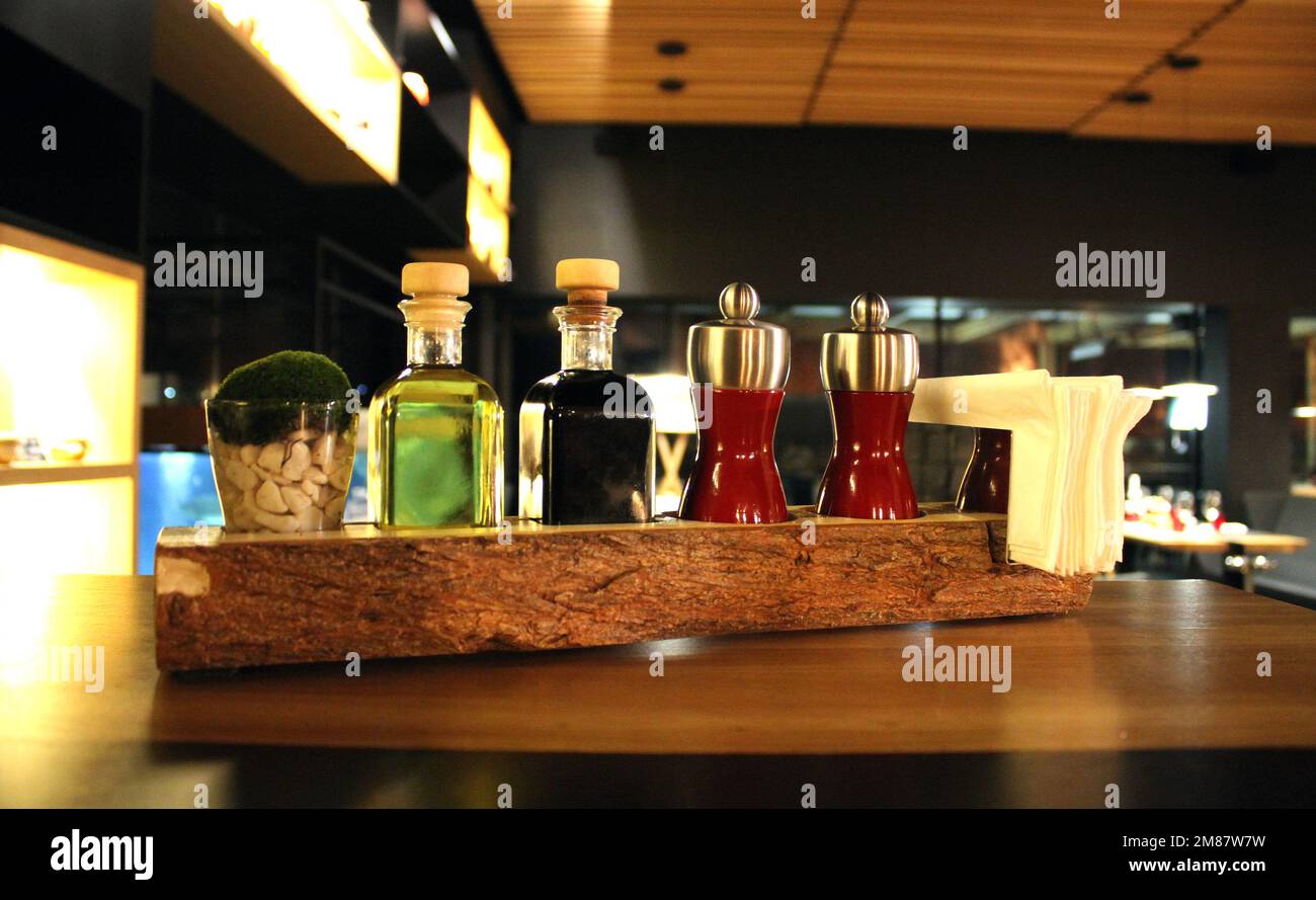 Spices And Condiments On A Restaurant Table Stock Photo