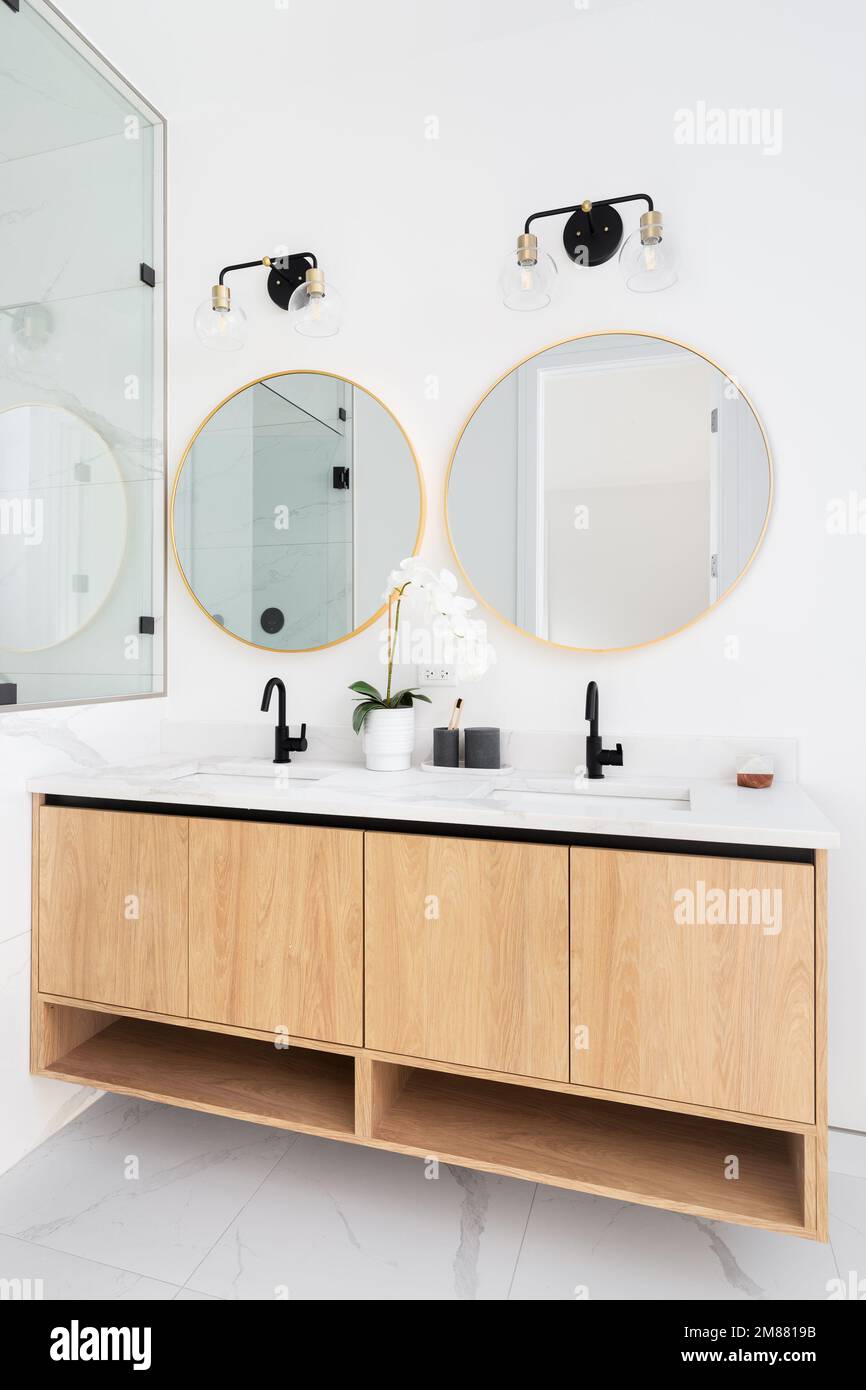A beautiful bathroom with a floating wood marble countertop