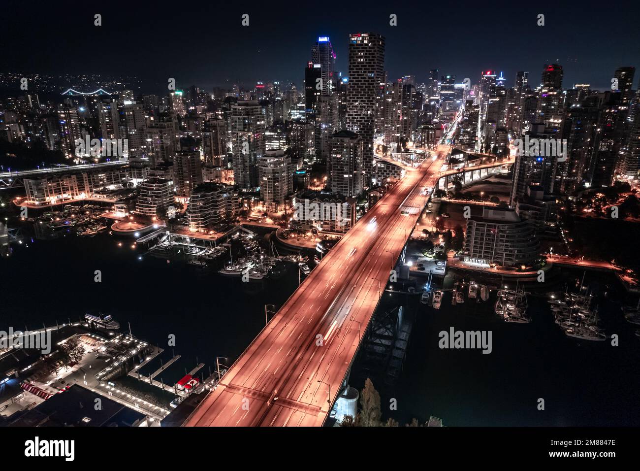 Downtown Vancouver night, British Columbia, high rise apartment buildings, office tower, city center. Stock Photo