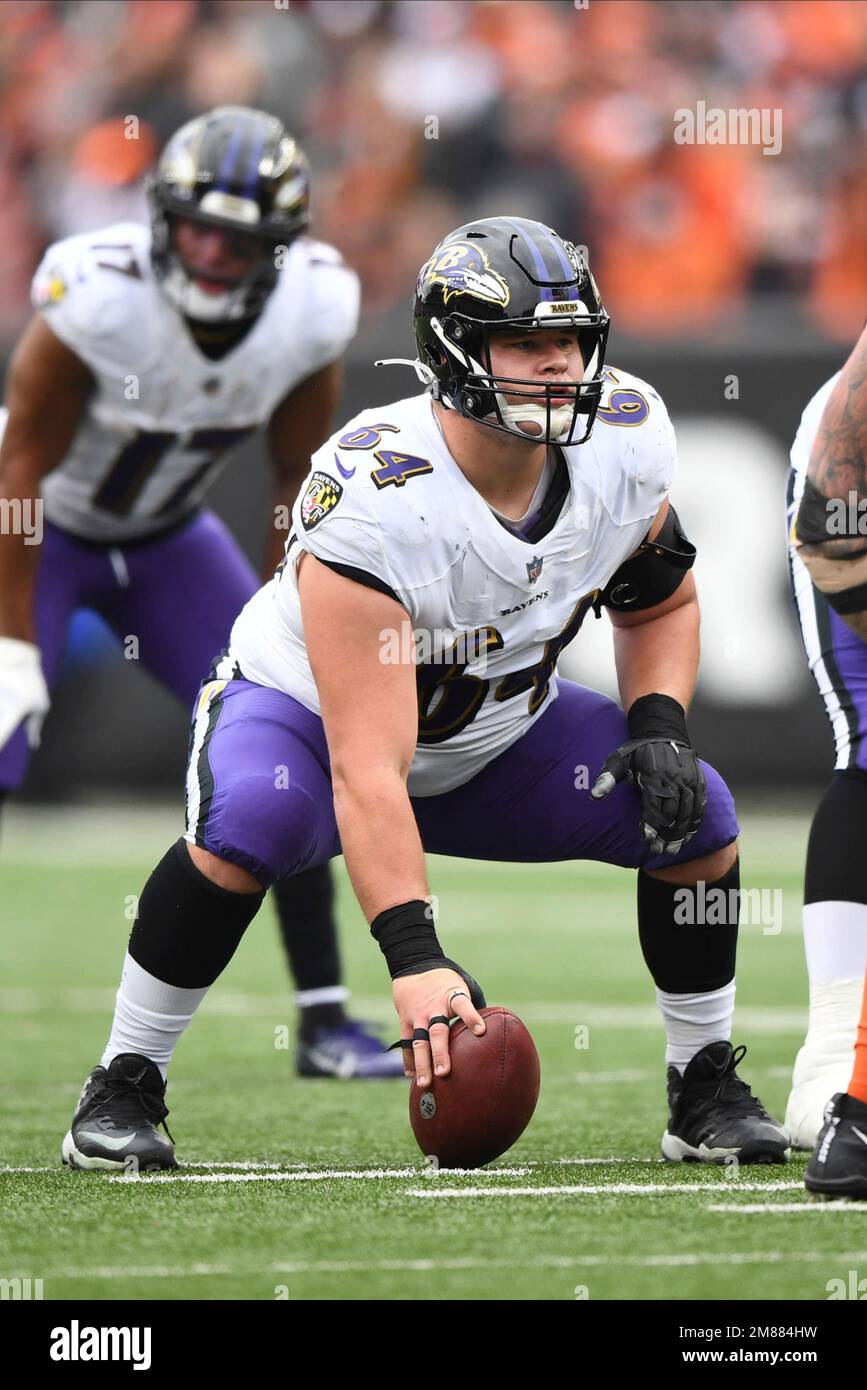 Baltimore Ravens center Tyler Linderbaum (64) looks on during pre