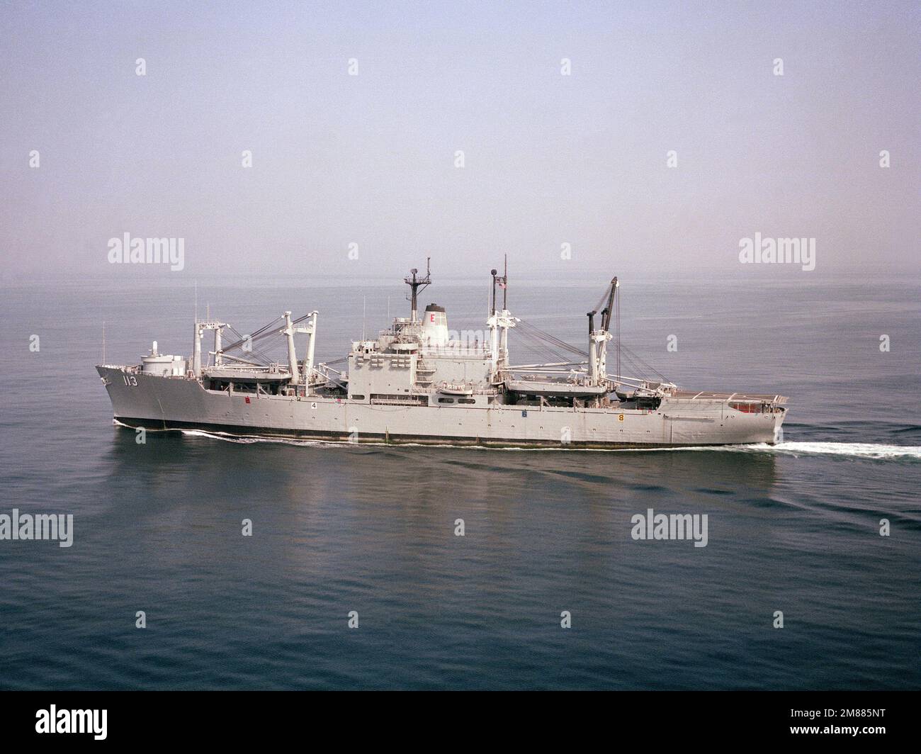 A port beam view of the amphibious cargo ship USS CHARLESTON (LKA 113 ...