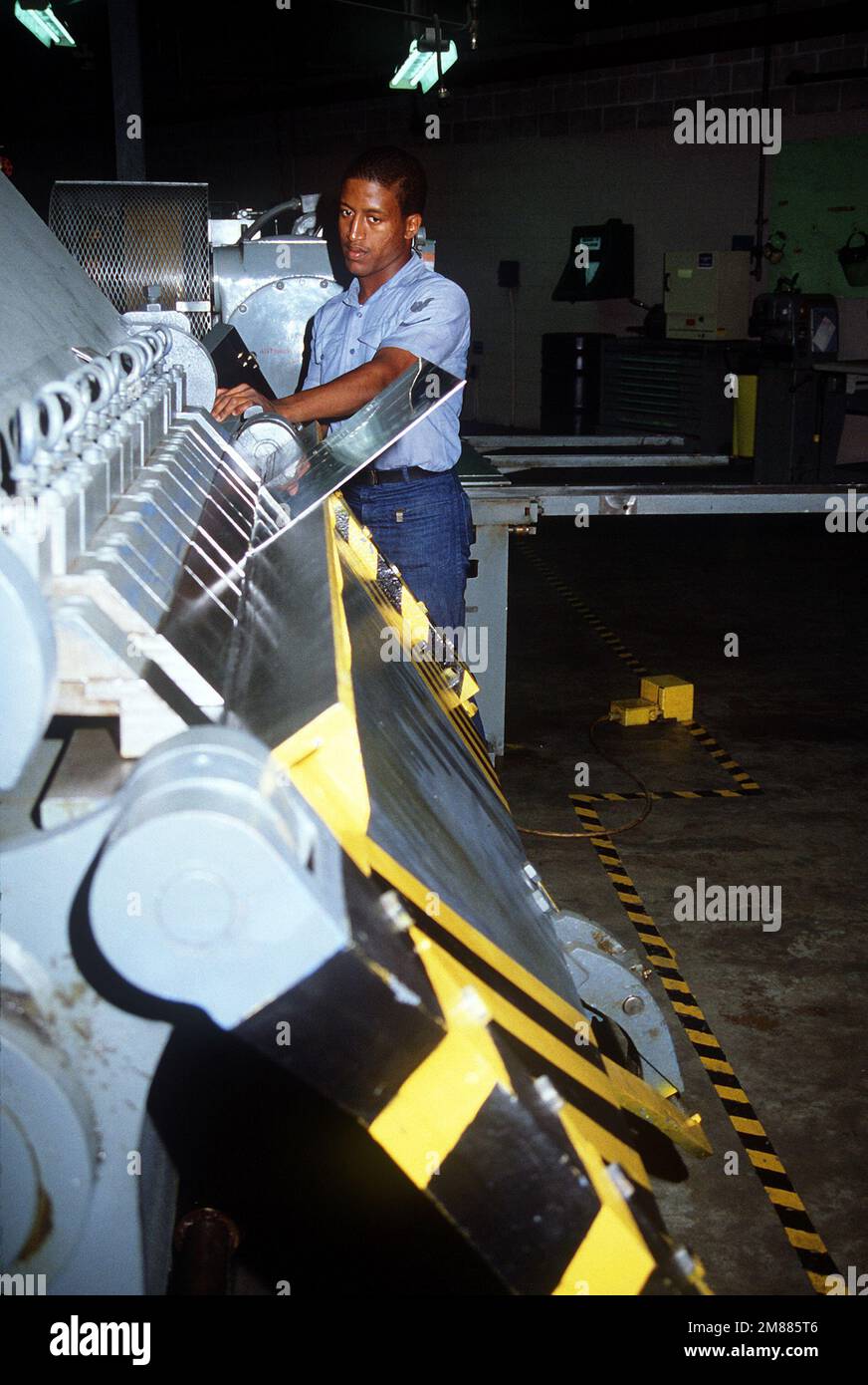 Aviation Structual Mechanic S (Structures) 3rd Class L. Bedford stands