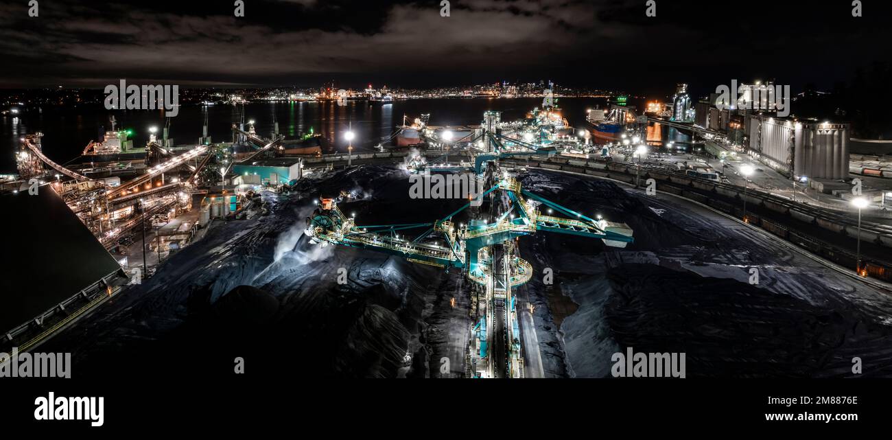 Rotary shovel at coal pile, bulk shipping terminal, silos, grain