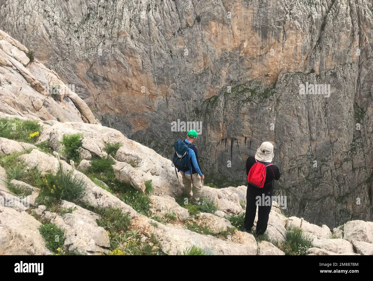 Mountaineers watch Cimbar Valley on Aladaglar National Park in Nigde, Turkey. Aladaglar is most important mountain range in Turkey. Stock Photo