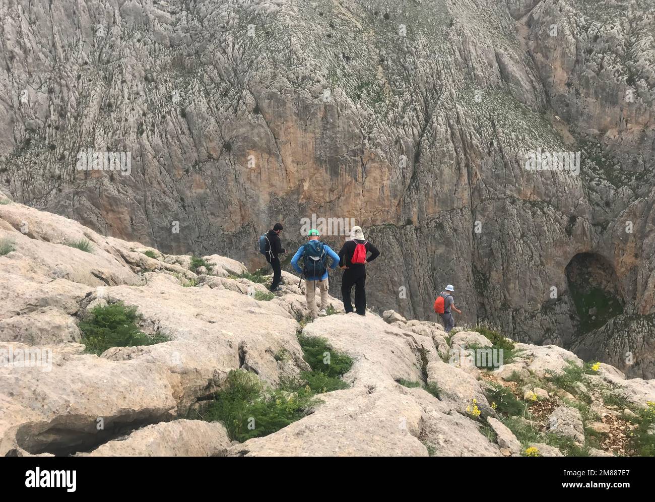 Mountaineers watch Cimbar Valley on Aladaglar National Park in Nigde, Turkey. Aladaglar is most important mountain range in Turkey. Stock Photo