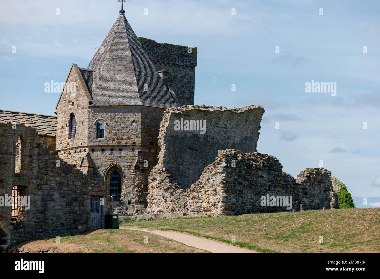 Side view of Inchcolm Abbey showing the Chapter House and remains of the chapel Stock Photo