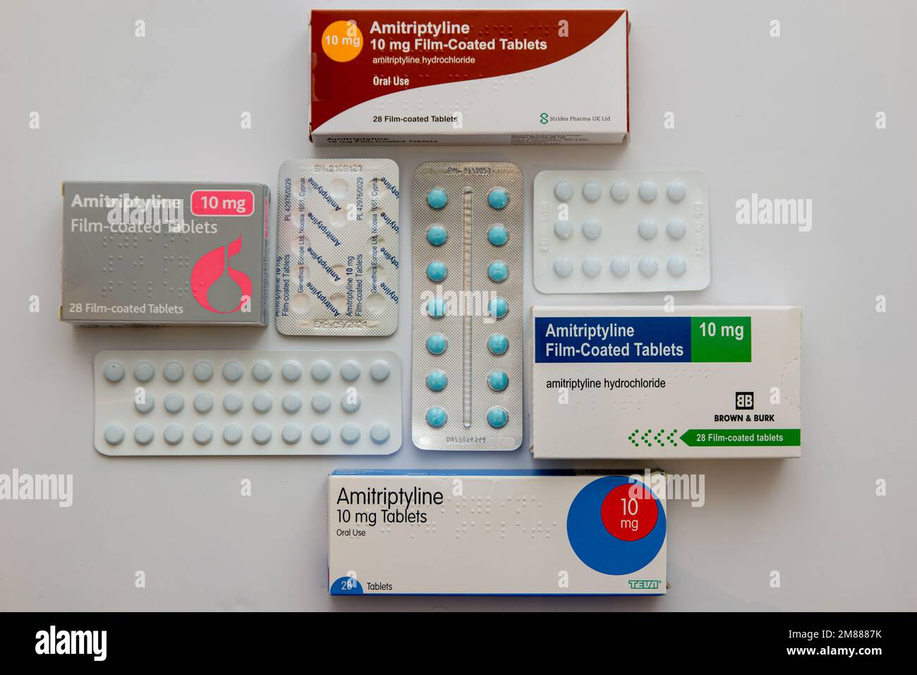 Boxes and blister packs of various generic brands of 10mg Amitriptyline Hydrochloride tablets on white background Stock Photo