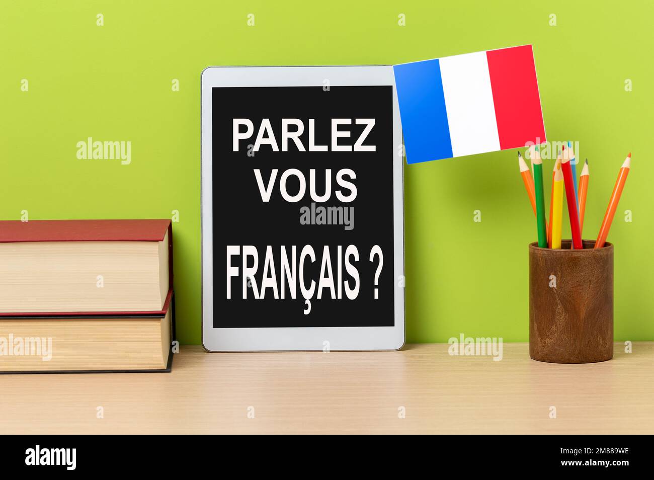 A digital tablet with the question parlezvous francais? do you speak french? written in french