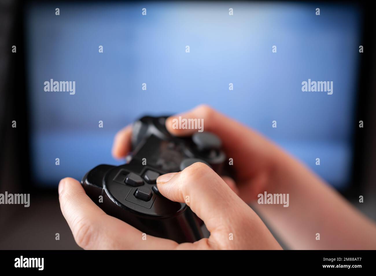 Cheerful boyfriend and girlfriend playing video games to win. Happy couple  using controller to play online game and winning gameplay on console.  People holding joystick to have fun Stock Photo - Alamy