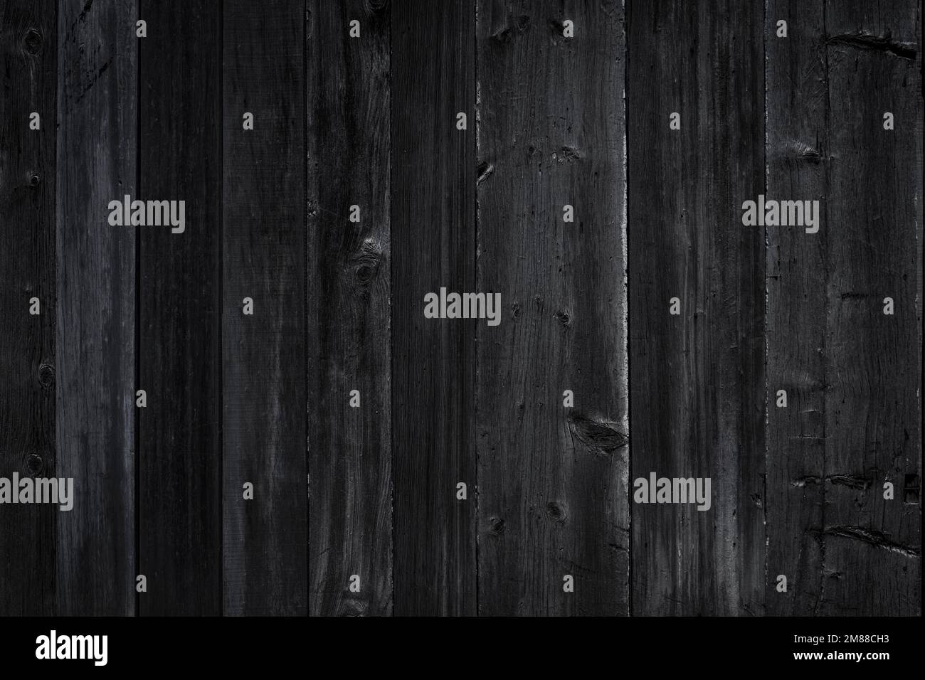 Black wooden planks background wall. Textured black rustic wood old dark paneling for walls, interiors and construction. High quality photo Stock Photo