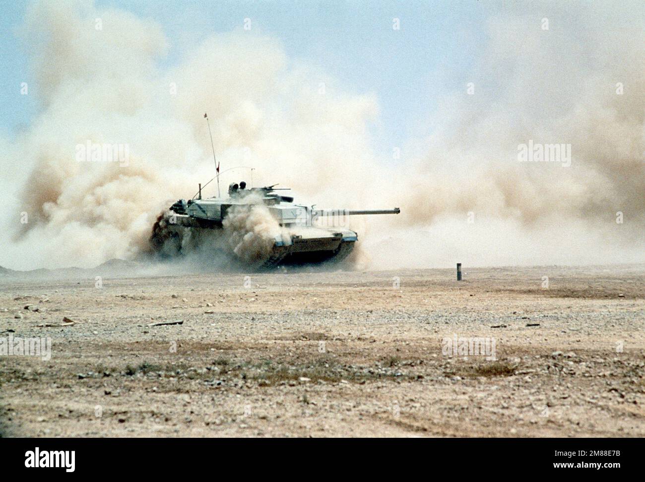 An M-1A1 Abrams main battle tank fires its 120mm main gun during Exercise Shadow Hawk '87, a phase of Exercise Bright Star '87. The exercise will evaluate procedures used to deploy U.S. tactical and logistical forces. Subject Operation/Series: SHADOW HAWK '87BRIGHT STAR '87 Base: Amman Country: Jordan (JOR) Stock Photo