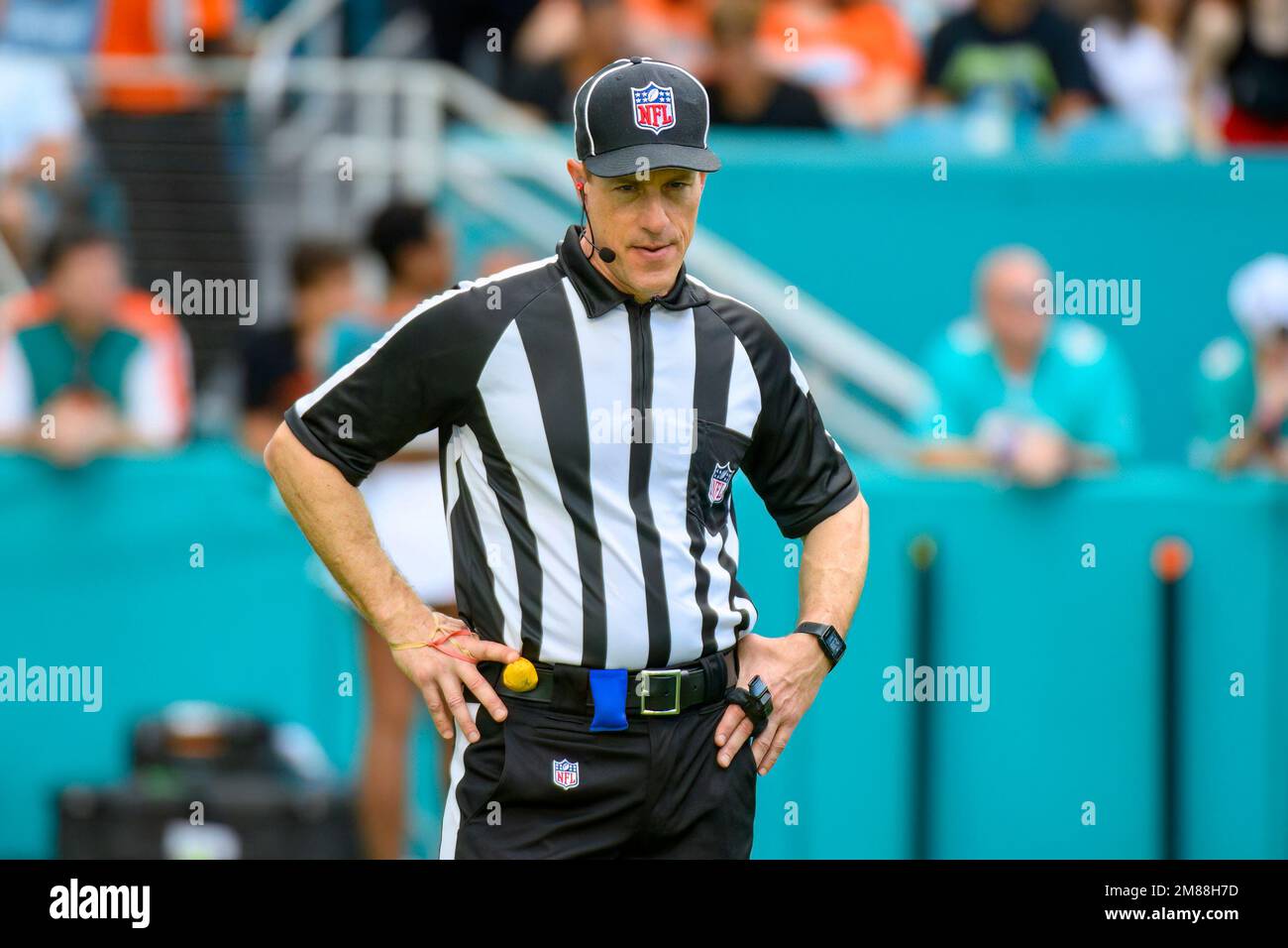 NFL Umpire Alan Eck stands on the field during an NFL football game