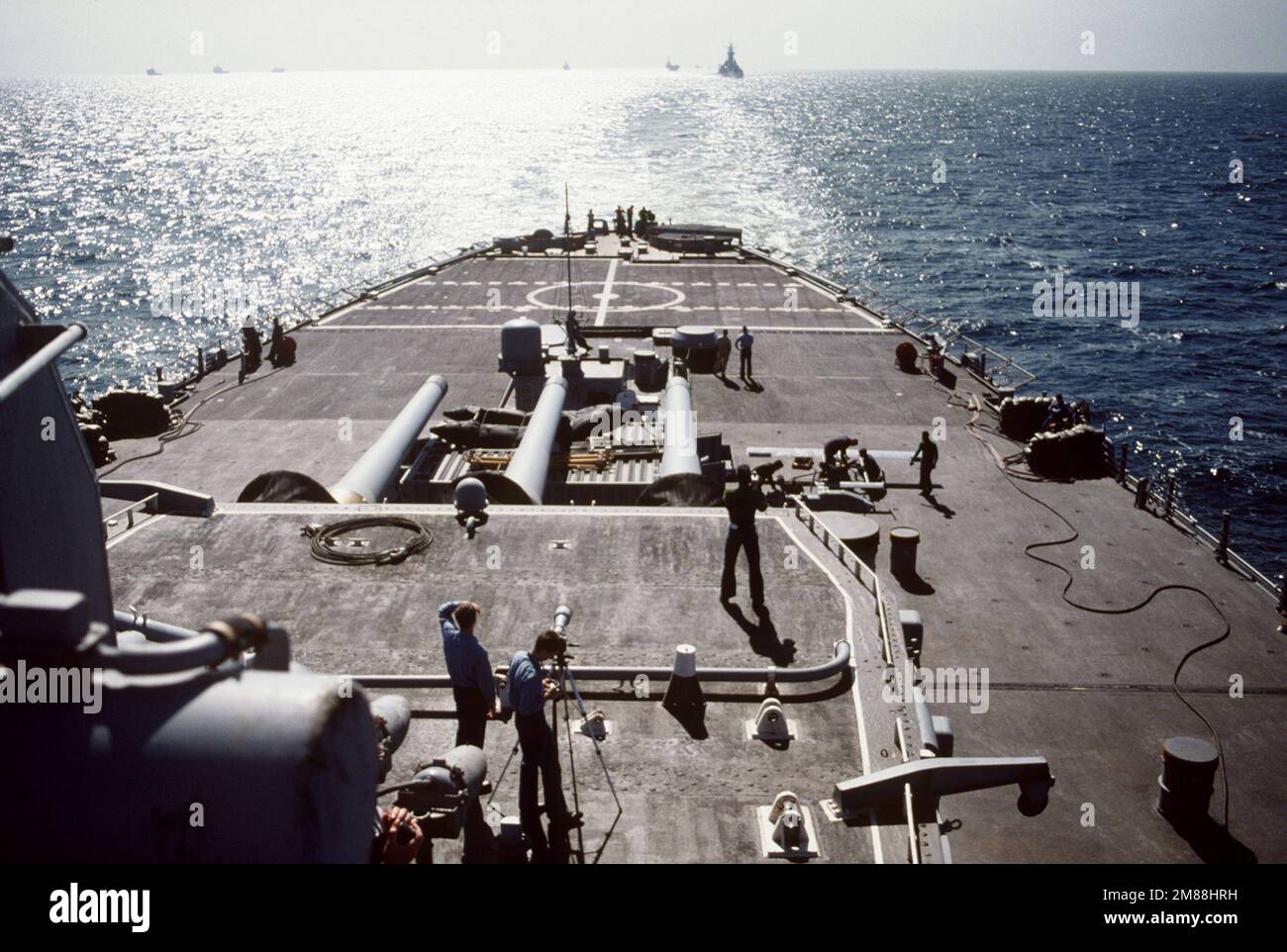 A photographer's mate stands on the No. 3 Mark 7 16-inch gun turret on ...