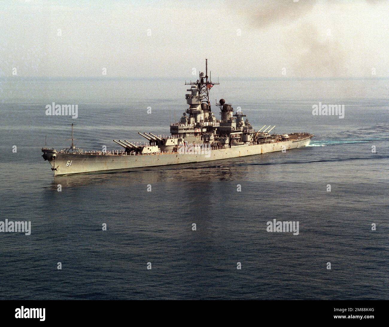 A port bow view of the battleship USS IOWA (BB 61) underway. Base: Augusta Bay Country: Sicily (SIC) Stock Photo