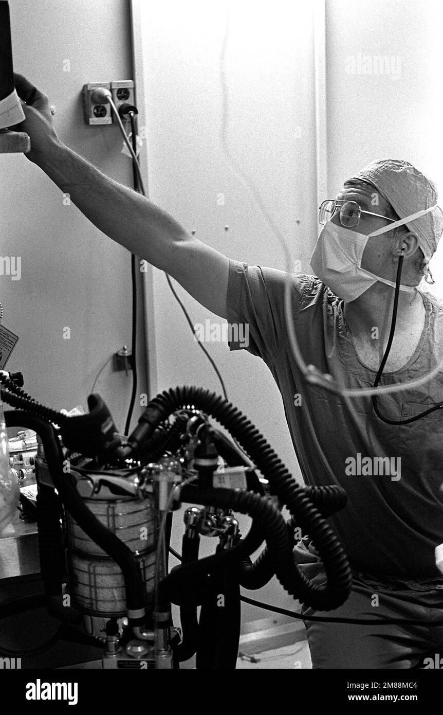Nurse Anesthetist LT. CMDR. John Hutchins checks his monitoring ...