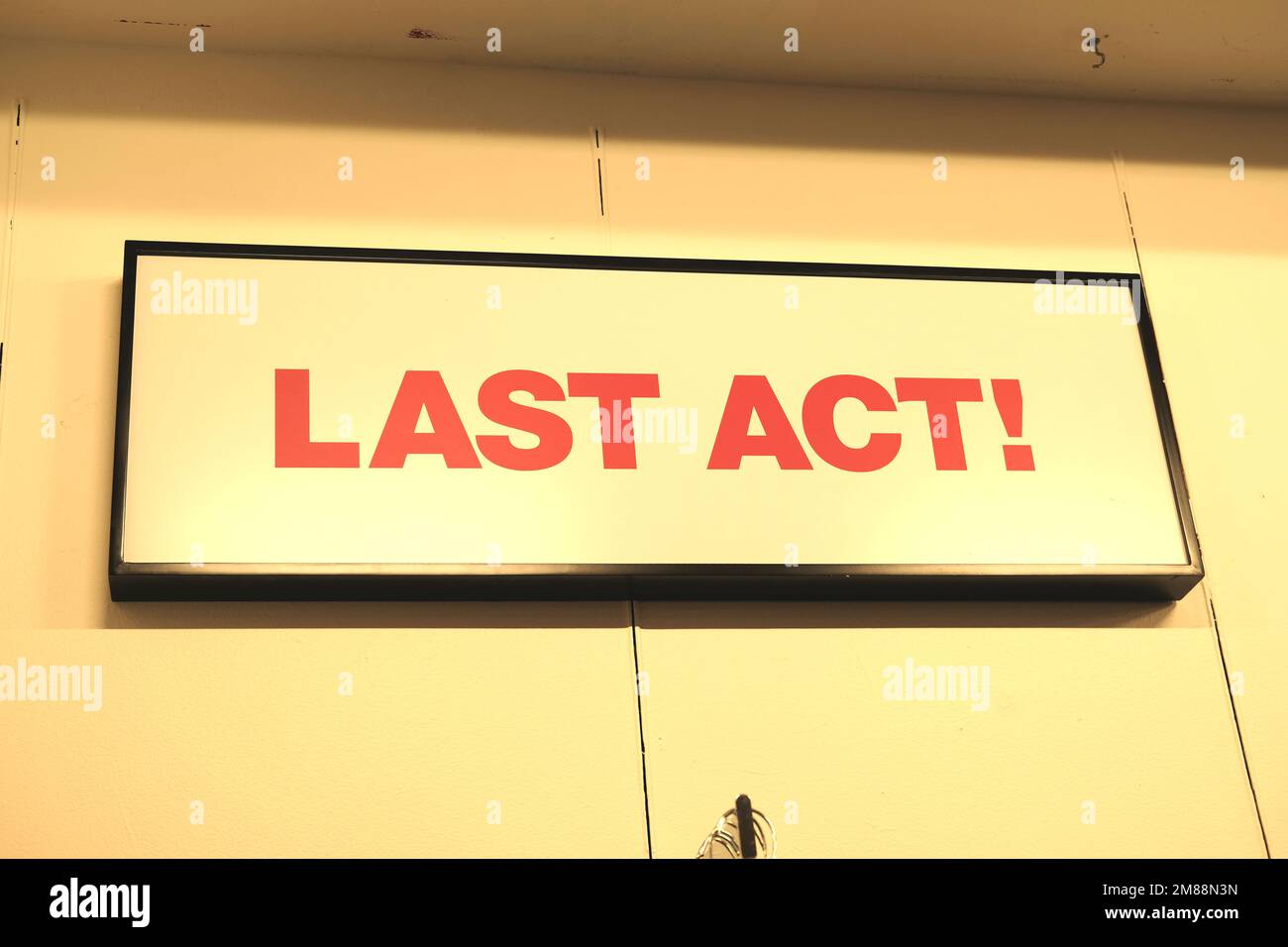 Interior sign at a Macy's Department store where last chance bargains can be found; Last Act!; end of the road, the end, no more, death concept. Stock Photo